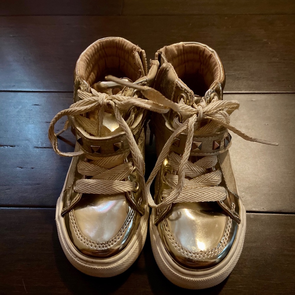 Gold high tops with stud accents